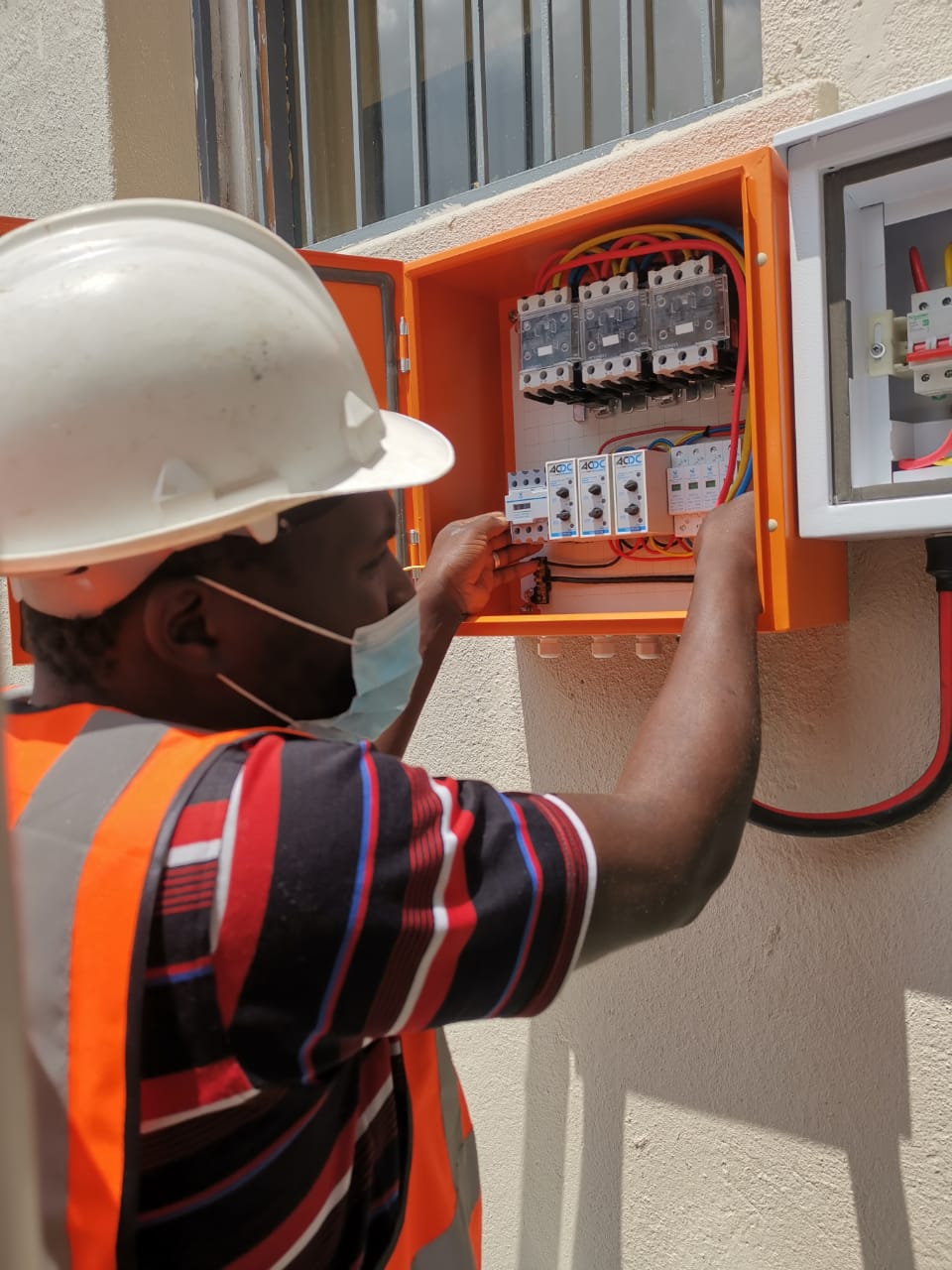 worker servicing a distribution box