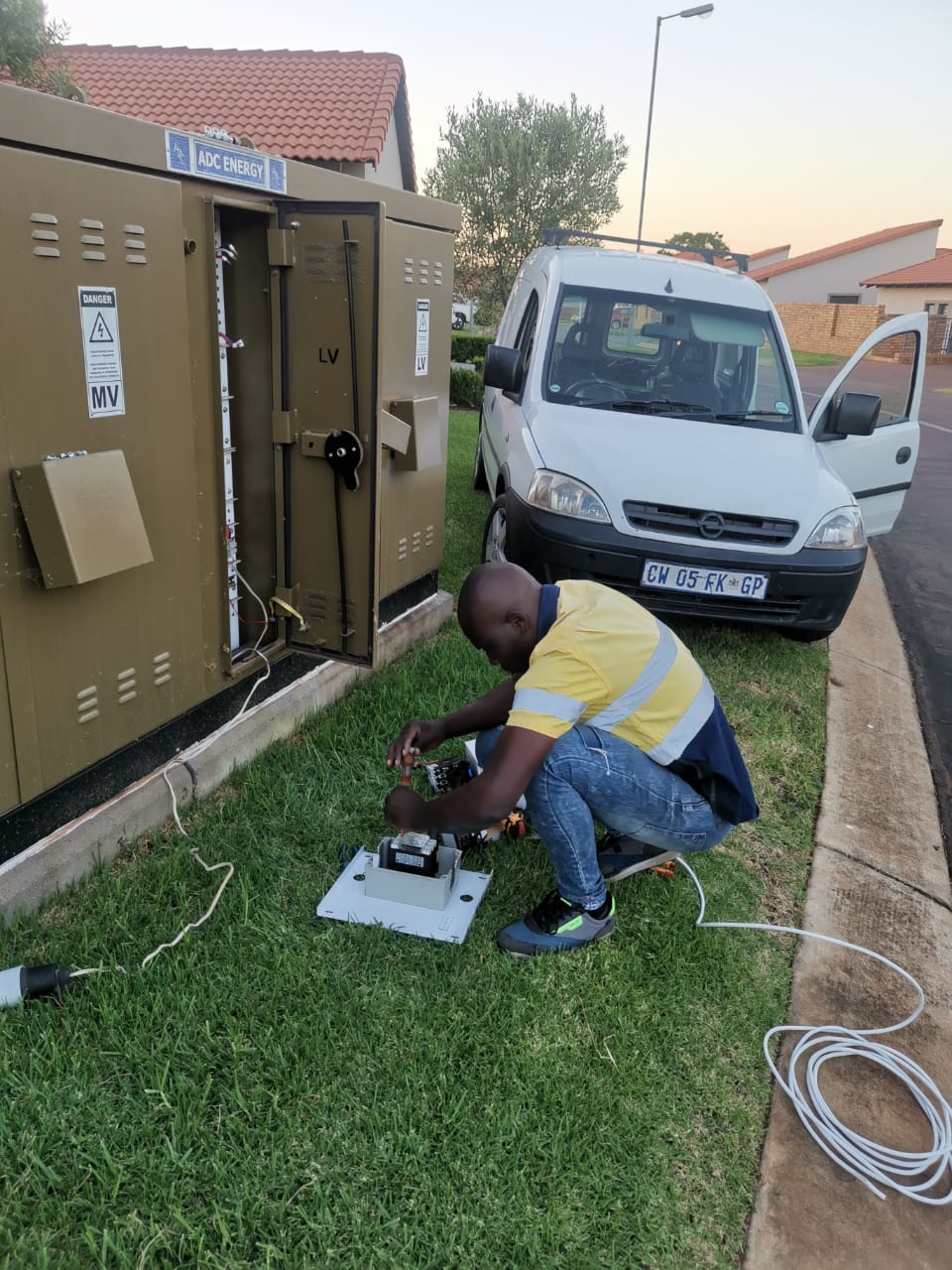 worker servicing street transformer